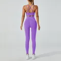 Two piece purple seamless yoga set featuring criss-cross sports bra and high waist leggings - Purple