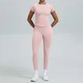 Roze naadloze yogaset met top met korte mouwen en legging voor professionele fitnesstraining - XS / Boven- En Onderstuk / Broek Set / Pareloze