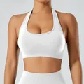 White halter neck sports bra featuring a supportive U-neck and ribbed texture for yoga - S / Tops / White
