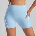 Light blue high waisted athletic shorts with white side stripes for yoga and fitness. - Water Blue