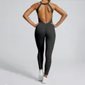 Back view of a black backless one-piece yoga jumpsuit with waist-slimming design - S / Top And Bottom / Premium Black