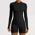 Black seamless ribbed yoga set featuring a zip-up long sleeve top and matching shorts. - S / Tops / Black