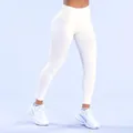 High-waisted seamless white yoga leggings with lifting effect for gym and fitness - White