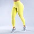 High-waisted quick-dry yoga leggings in vibrant yellow with peach lift design - Light Yellow