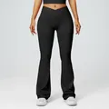 High-waisted black flared yoga pants with a v-cross waistband for gym and fitness - Black