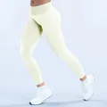 High-waisted seamless cream yoga leggings with scrunch butt lifting effect for gym - Light Cream Yellow