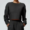 Black cropped sweatshirt and sweatpants set for sports or casual wear. - Black