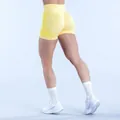 Back view detail of yellow high-waist seamless scrunch butt yoga shorts for workout - Lemon Yellow