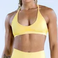 Detail view of a yellow seamless high-elastic yoga sports bra with jacquard texture. - Lemon Yellow