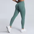 High-waisted seamless peach butt-lifting yoga leggings in matte teal green variant - Pale Green