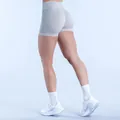 Detail showing the scrunch butt design of seamless high-waisted grey gym shorts - Clay Gray