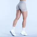 Back view of seamless high-waist fitness shorts with scrunch butt and textured pattern - Clay Gray
