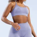 Detailed view of lavender seamless matte nylon sports bra with cross back design. - Light Purple