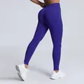 Seamless high-waisted peach lift yoga pants in vibrant purple matte finish - Indigo Blue