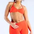 Naadloze oranje yogaset met halter sport-bh en fitnesslegging met een hoge taille - XS / Boven- En Onderstuk / Chilirood