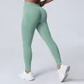 Seamless matte high-waisted yoga leggings with peach butt-lifting effect in light green - Palm Green