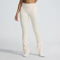 Cream high-waisted seamless flare yoga pants with fold-over waistband and ribbed texture - S / Bottoms / Sand-washed Beige
