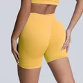 Premium yellow high-waist seamless yoga shorts for women featuring tummy control and lift - Yellow