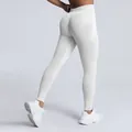 High-performance white seamless high waist gym leggings featuring peach lift design for yoga - Pure White