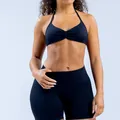 Professional seamless black yoga halter bra and high-waist sports shorts set for fitness - Black