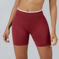 High-waist deep red seamless yoga shorts for women featuring white contrast trim detail - XS / Bottoms / Cherry Red