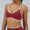 Burgundy sports bra with white contrast trim and thin straps for yoga and fitness - XS / Tops / Cherry Red