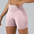 High-waisted seamless pink yoga shorts with scrunch butt lift for fitness training. - XS / Bottoms / Pink
