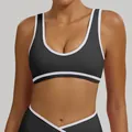 Black and white contrast color sports bra with wide straps for yoga and fitness training - S / Tops / Black