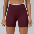 Maroon high-waist seamless yoga shorts featuring a white contrast trim and ribbed waistband - Chestnut