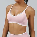 Pink strappy sports bra with white trim contrast for yoga and outdoor fitness training - XS / Tops / Pink