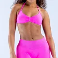 Vibrant neon pink seamless halter sports bra made from high-elastic matte nylon material. - Bright Purple-Red