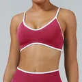 High-stretch maroon seamless sports bra with white contrast piping for yoga and fitness - XS / Tops / Raspberry