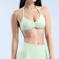 Naadloze lichtgroene yoga fitness set met halterbeha en legging met een hoge taille - XS / Boven- En Onderstuk / Palm Groen