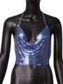 Macro view of the shiny blue metallic sequin texture on a sexy women's halter neck top - Sapphire Blue