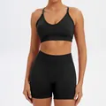 Women's seamless black yoga set featuring V-neck sports bra and matching high-waisted shorts - XS / Top And Bottom / Bra + Shorts / Black