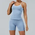 Professional light blue and white color-block yoga set featuring a tank top and sports shorts. - XS / Top And Bottom / Baby Blue