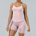 Two-piece pink yoga set with white trim camisole and matching tight athletic shorts - XS / Top And Bottom / Pink
