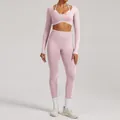 Soft pink seamless yoga set featuring long-sleeve crop top and high-waist leggings - XS / Top And Bottom / Pink