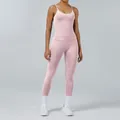 High-performance light pink yoga set featuring a tight-fitting tank top and leggings. - XS / Top And Bottom / Pink
