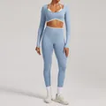 High-quality blue seamless long-sleeve yoga set with high-waist leggings and white trim details - XS / Top And Bottom / Baby Blue