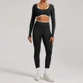 Two-piece seamless yoga set with long-sleeved cutout top and leggings in black - XS / Top And Bottom / Black
