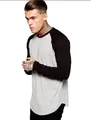 Close-up of a men's grey and black color-block raglan long sleeve t-shirt with curved hem - M / Tops / Light Gray
