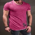Detailed view of the distressed holes on a men's burgundy short sleeve T-shirt - S / Tops / Burgundy