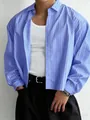 Detail shot of men's blue striped shirt with loose fit styling over white tank top - M / Tops / Sky Blue