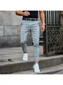 Detail of men's slim-fit grey plaid trousers paired with white velcro sneakers outdoors - 3XL / Bottoms / Light Blue