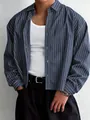 Close-up of loose-fit men's blue pinstripe long-sleeve shirt with casual styling - M / Tops / Navy Blue