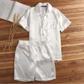 Close-up detail of the smooth white satin men's pajama set with shirt and shorts set - M / Top And Bottom / White