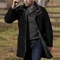 Detailed shot of a men's mid-length black wool coat with fur collar in outdoor setting - Black