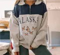 Detailed view of women's grey and blue half-zip sweatshirt with Alaska and butterfly print - Butterfly Blue