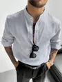 Detail of a men's light blue seersucker striped shirt with a mandarin collar - M / Tops / Gray